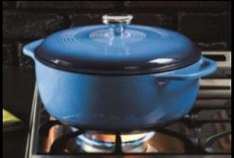 Blue enameled pot on gas stove, heating up with flame. 