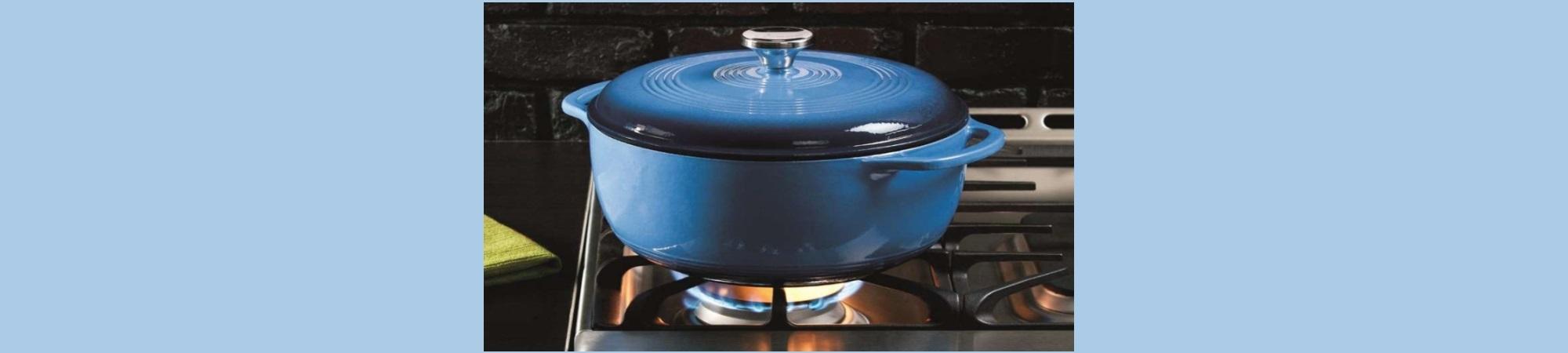 Blue enameled pot on gas stove, heating up. 