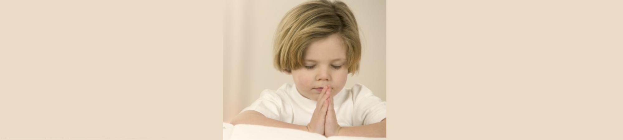 3-year-old girl in prayingl position. Soft pink. 