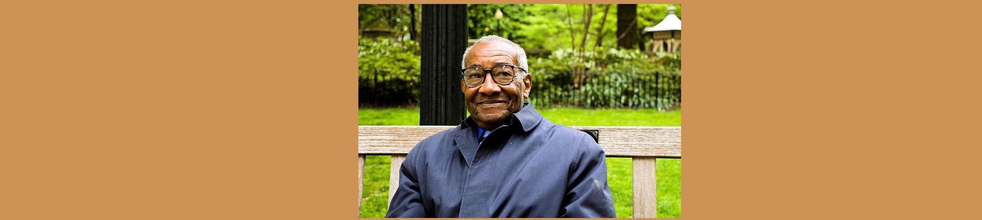 Kind man smiling from park bench