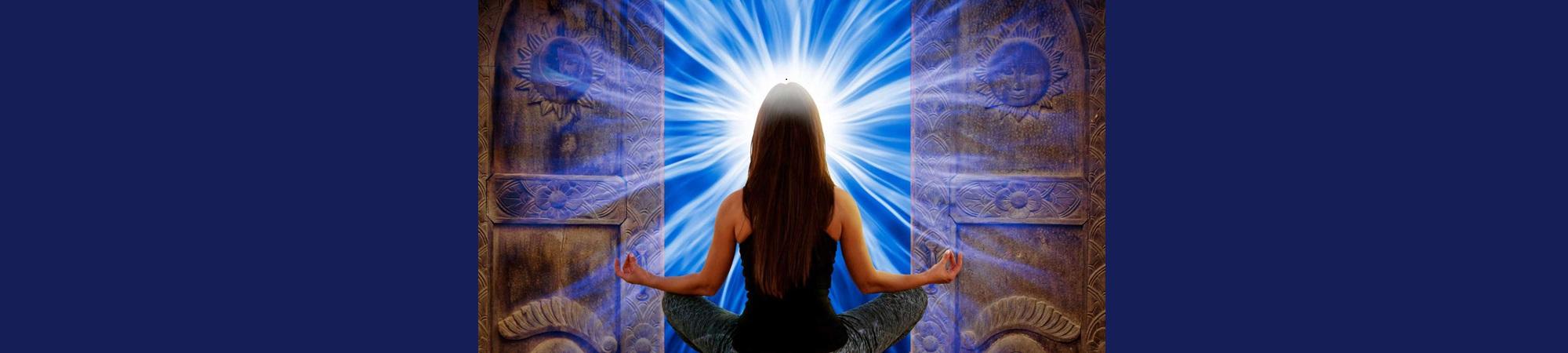 Back of woman meditating, white light around her head