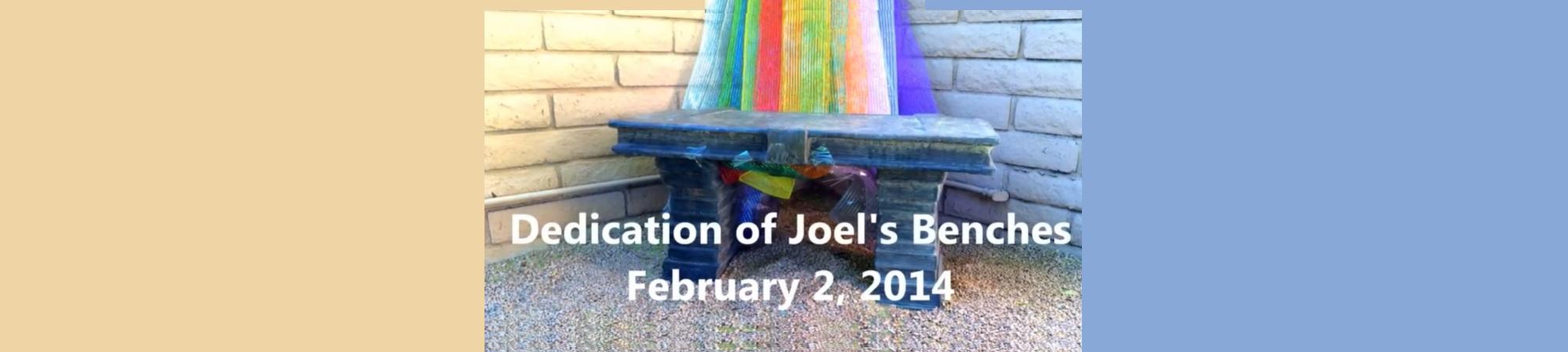 Meditation bench with colors of the rainbow behind.