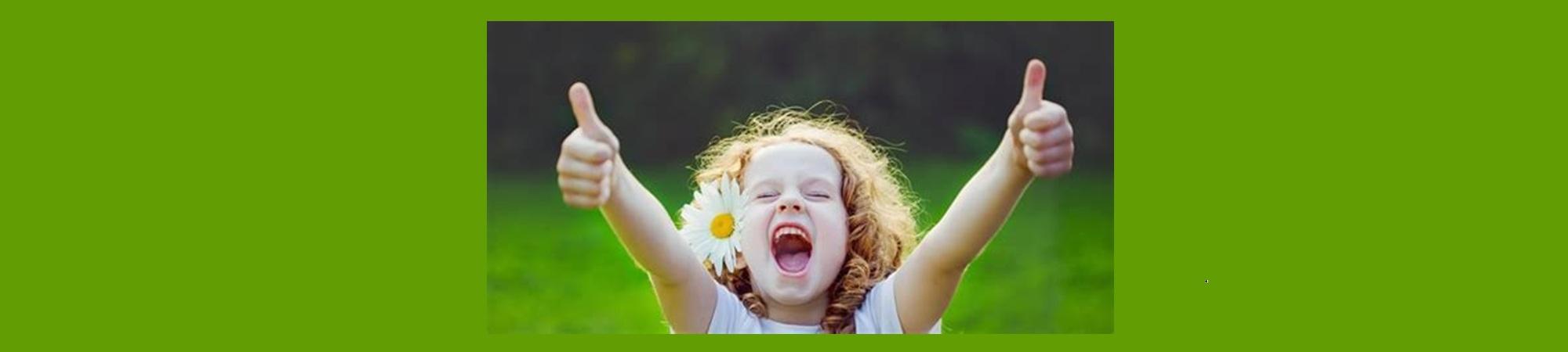 Enthusiastic child with tow thumbs up