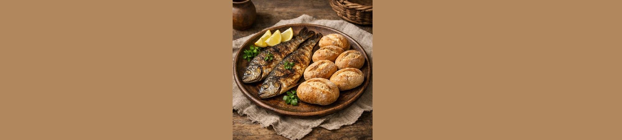 Plate of two broiled fish and five small loaves